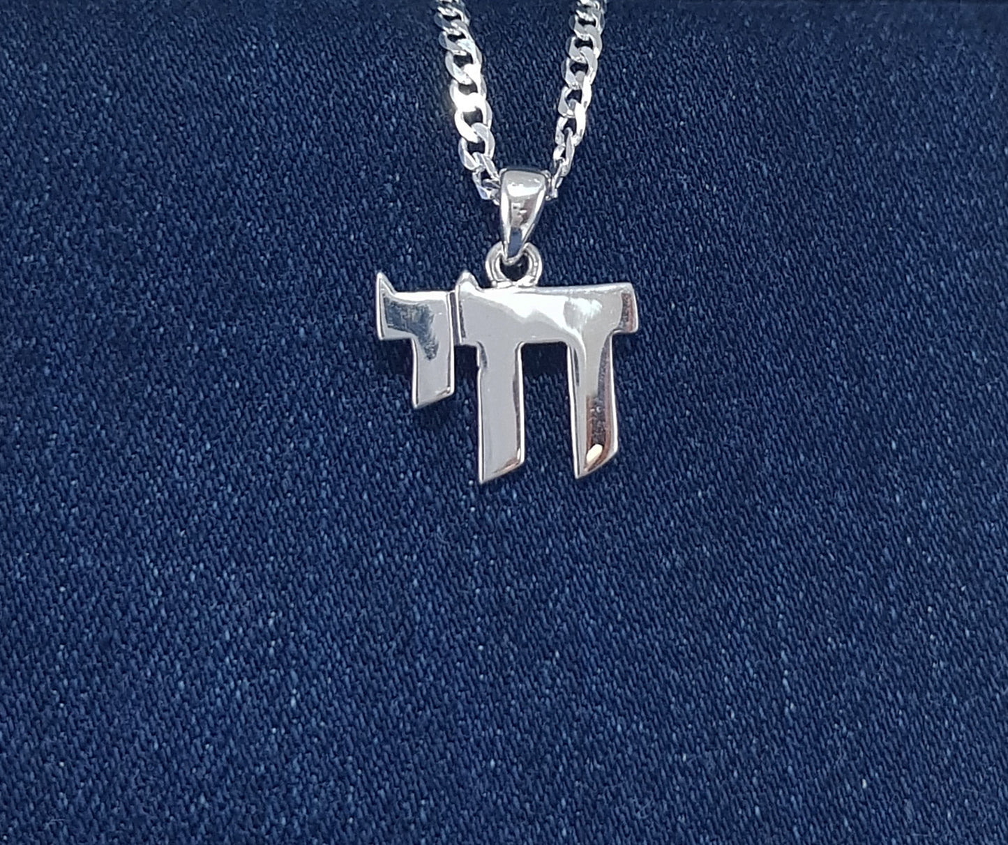 Sterling Silver Pendant with Hebrew Writing that says "life"