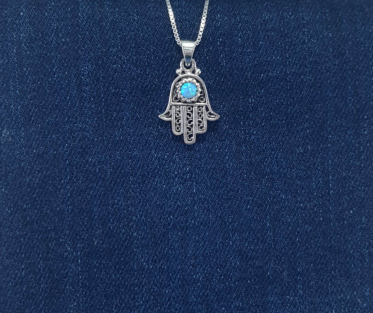 Sterling Silver Hamsa Hand Pendant in a filigree design with crushed opal inlay
