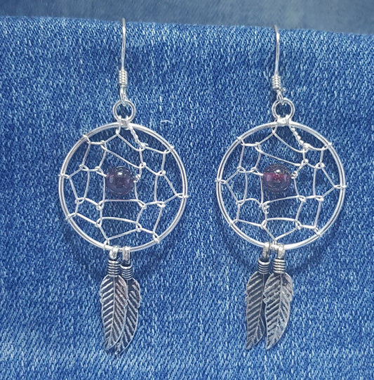 Enchanting dream catcher drop earrings, reminiscent of a whimsical and spiritual charm. 