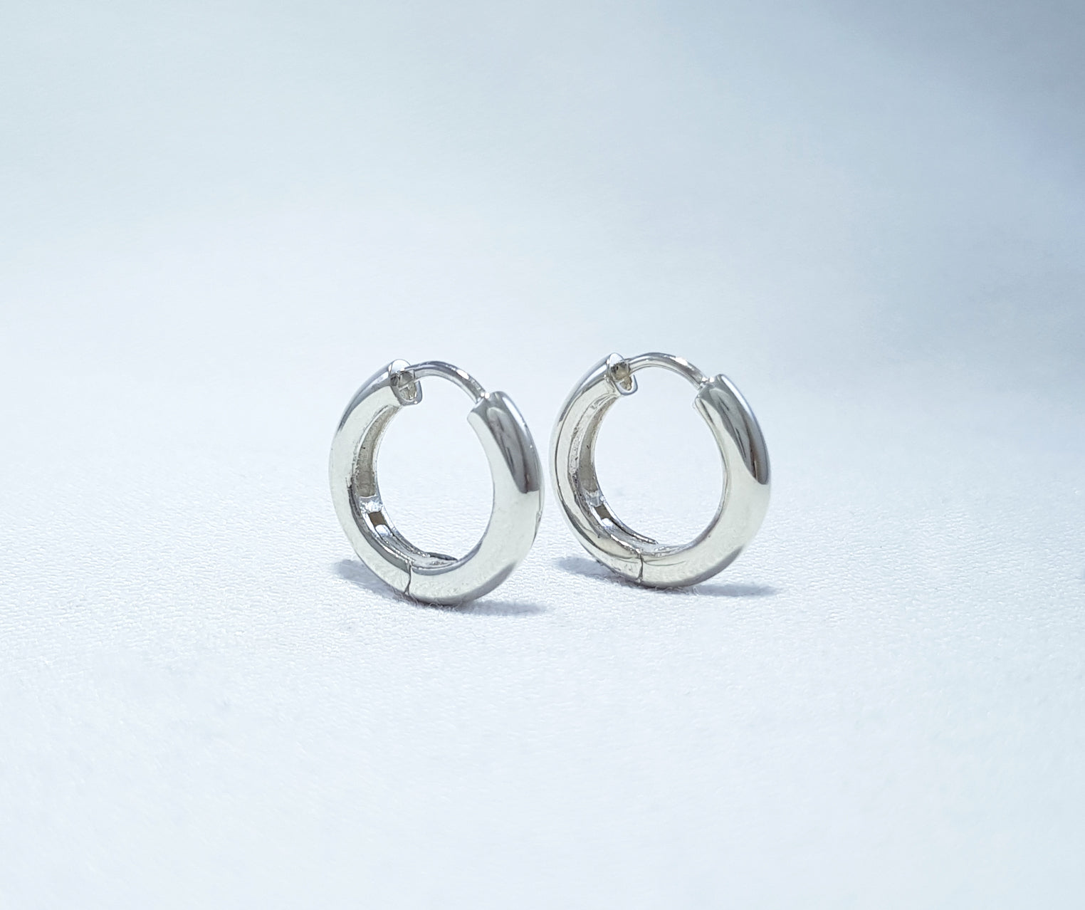 Sterling Silver Huggie Earrings - round profile