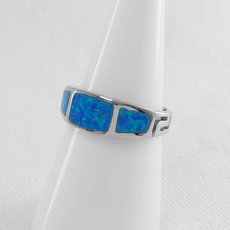 sterling silver band with blue opal inlay and a Greek meander pattern.