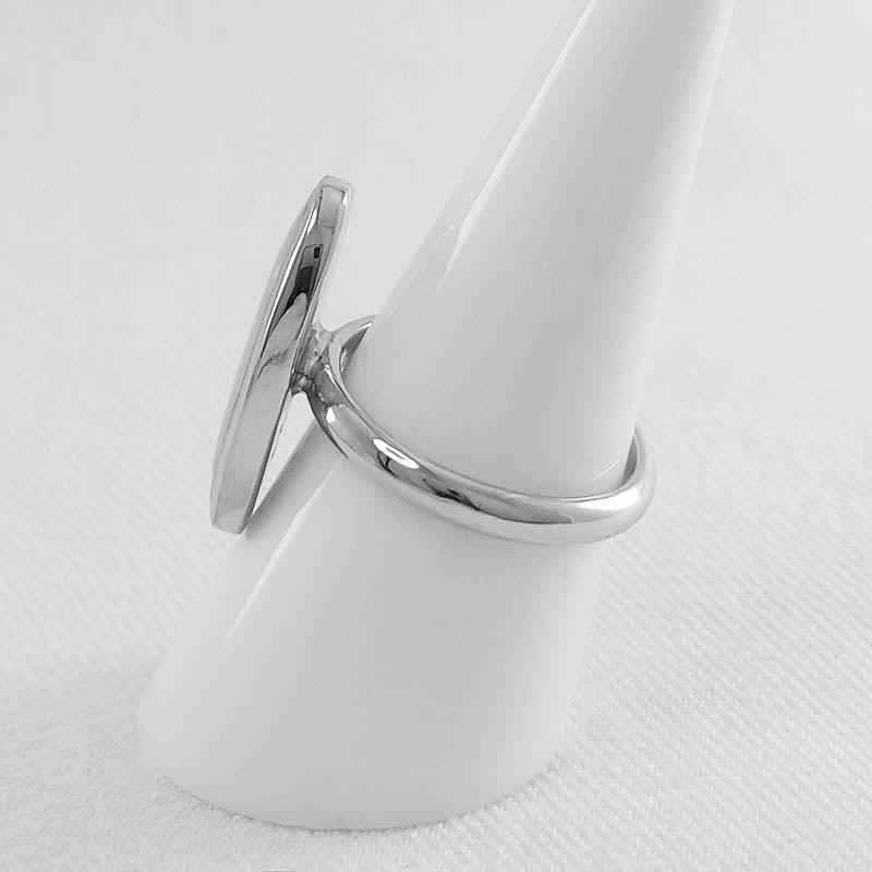 Sterling silver ring with a large oval white opal stone