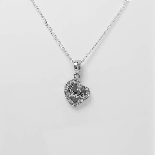 silver heart pendant with a silver curb chain