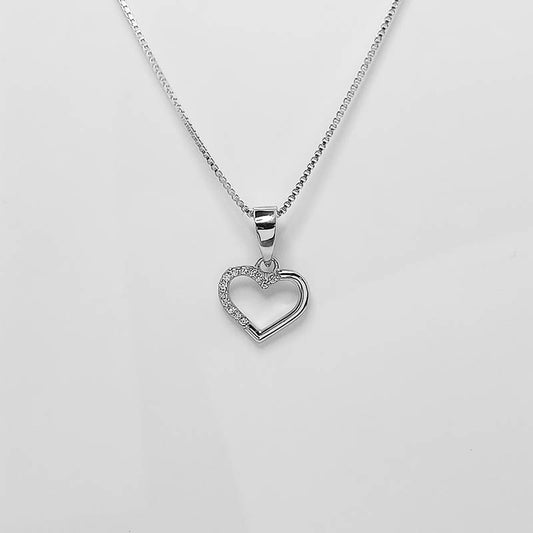 Small silver heart pendant with silver chain and cubic zirconia stones.