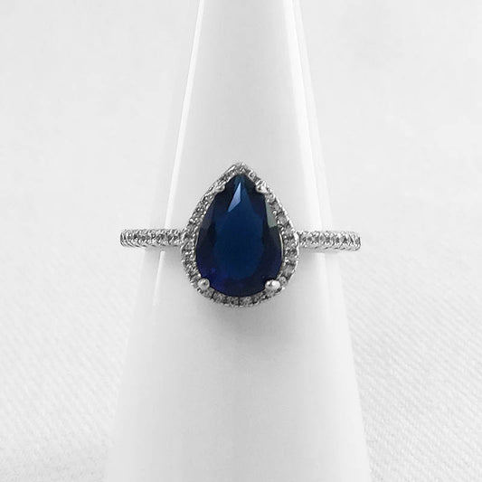 Sterling silver cubic ring with a blue, teardrop shaped cubic stone