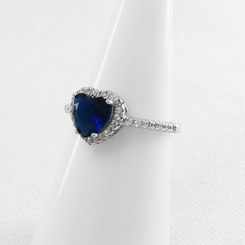 Silver heart ring with a blue, heart-shaped stone
