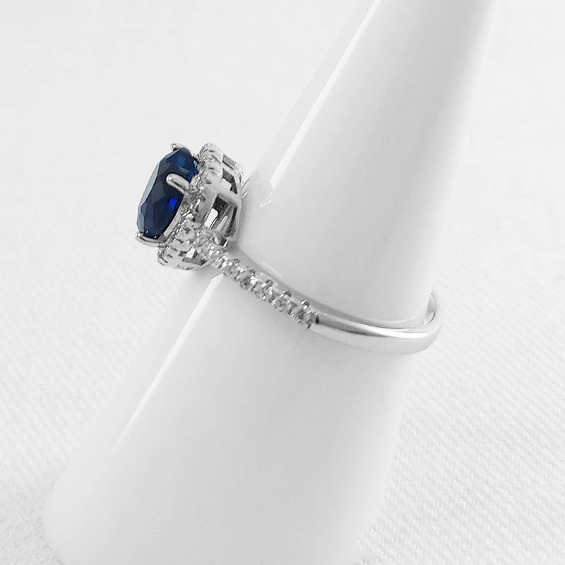 Silver heart ring with a blue, heart-shaped stone