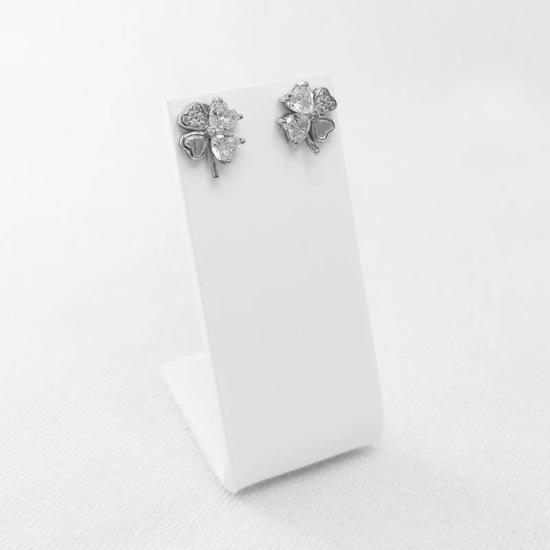 Sterling silver shamrock stud earrings with cubic zirconia stones.