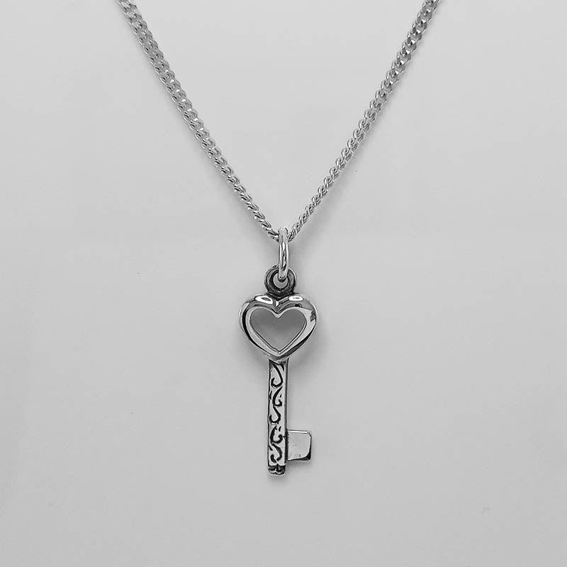 Sterling silver heart key charm with a silver chain.