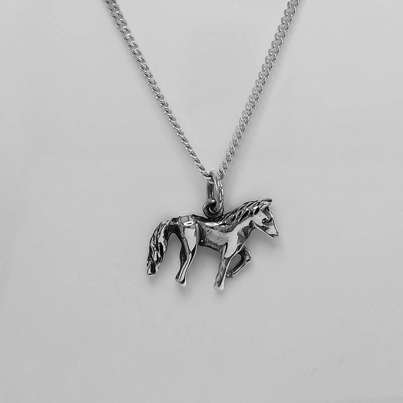 Small silver horse charm with a silver necklace