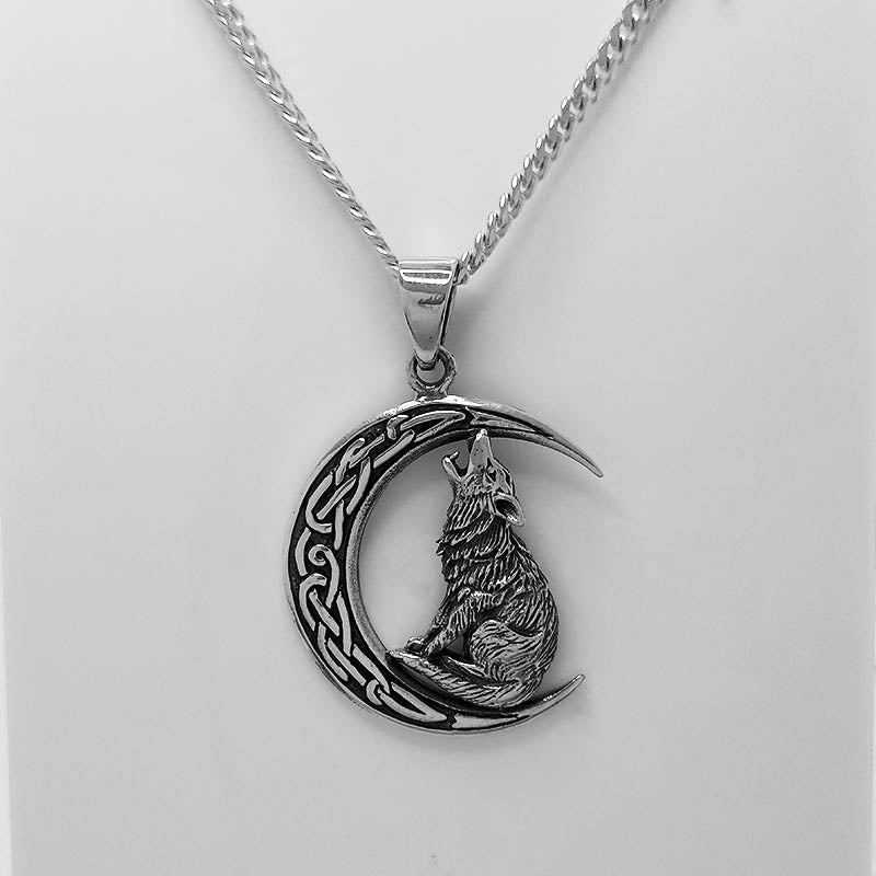 Sterling silver wolf howling at the moon pendant