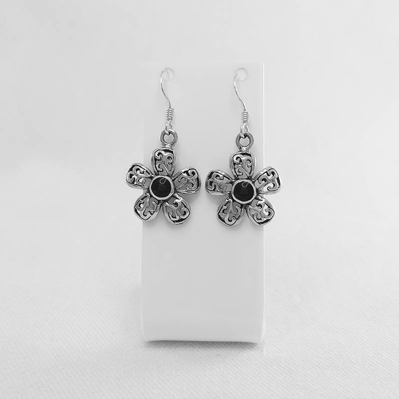 Sterling silver flower earrings with a black stone inlay