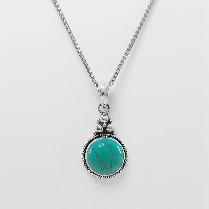 Sterling silver turquoise pendant with a silver chain.